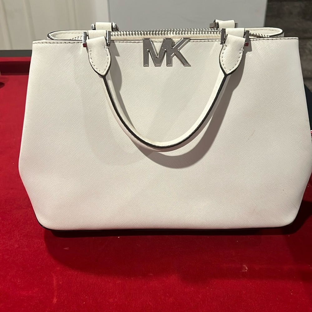 Cute white Michael Kors purse.